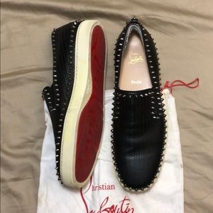 Christian Louboutin slip on studded shoes.